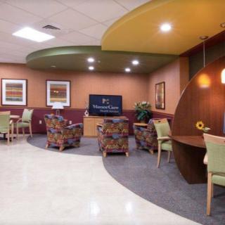 A modern waiting room with comfortable seating and vibrant decor.