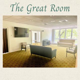 The Great Room with cozy seating and a large TV.