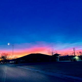 A stunning sunset paints the sky with vibrant colors, creating a picturesque evening scene.