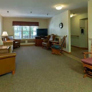 A cozy living room with comfortable seating and a television.