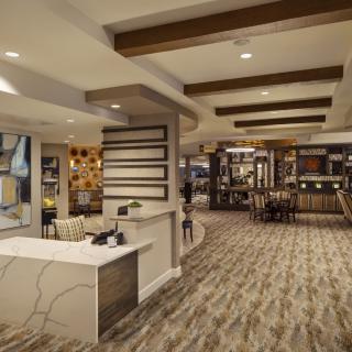 A modern hotel lobby with stylish interior design and ambient lighting.