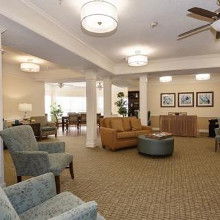 A spacious lobby with comfortable seating and soft lighting.