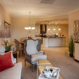 A beautifully designed living room featuring elegant furnishings and warm lighting.