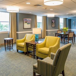 A modern lobby area featuring comfortable seating and elegant lighting.