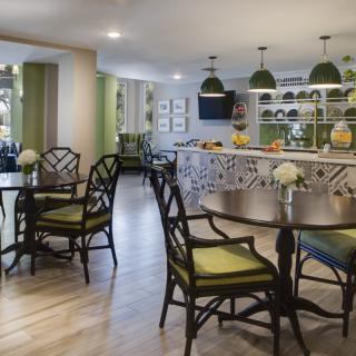 A modern and stylish dining area with elegant furniture and decor.