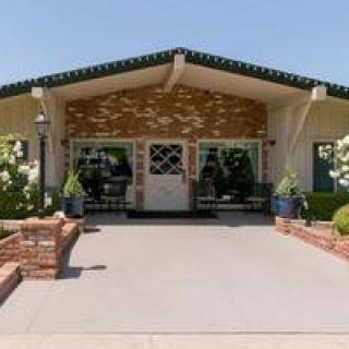 Front view of a house with landscaped entrance.