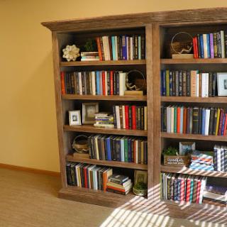 A beautifully arranged bookshelf filled with various books and decorative items.