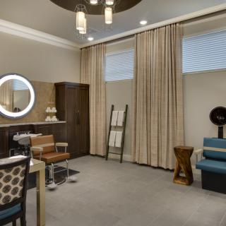 A modern living room with stylish furniture and elegant lighting.
