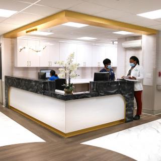 A modern medical reception area with a sleek design.