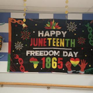 A vibrant banner celebrating Juneteenth, highlighting the significance of Freedom Day and its historical roots.
