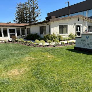 A well-maintained facility with landscaped gardens and clear signage.