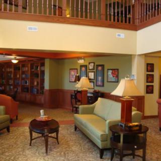 A cozy living room with comfortable seating and elegant decor.