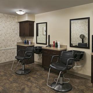 A modern salon interior with hairdressing stations and mirrors.