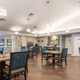 A cozy dining area with neatly arranged tables and comfortable seating.