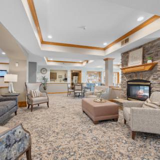 A cozy and inviting living room featuring a modern design with a fireplace.