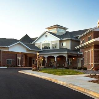 A modern residential building with a welcoming entrance and well-maintained landscaping.