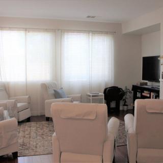 A cozy living room with comfortable seating and soft lighting.