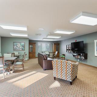 A modern living room with comfortable seating, a television, and stylish decor.