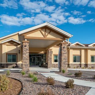 A modern building with a welcoming entrance on a sunny day.