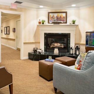 A cozy living room with a fireplace and comfortable seating.