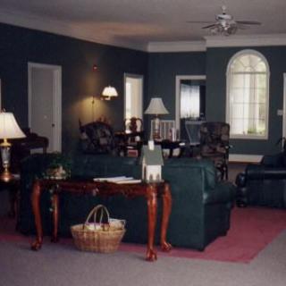 A cozy living room with elegant furnishings and soft lighting.