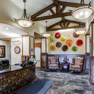 A welcoming lobby featuring artistic wall decor and comfortable seating.