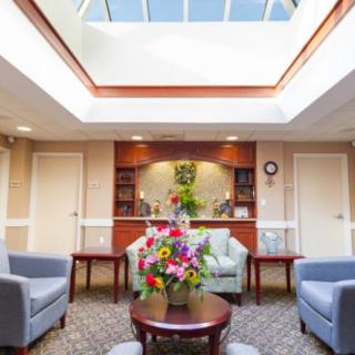 A welcoming lobby area with comfortable seating and a skylight.
