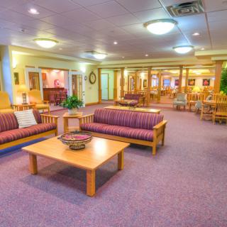 A spacious lobby with comfortable seating and bright lighting.