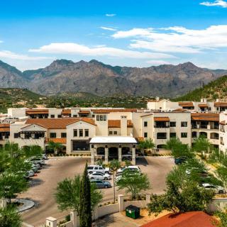 A scenic view of a resort nestled against a mountainous landscape.