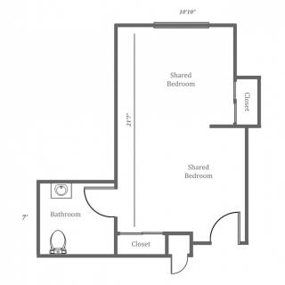 A simple floor plan of a studio apartment with a main bedroom area, bathroom, closet, and kitchen.