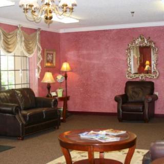 A cozy living room with elegant furniture and decor.