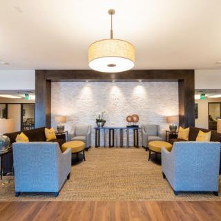 Modern lobby with comfortable seating and elegant decor.