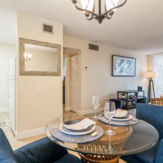A cozy dining area with a modern table setting in an elegantly decorated apartment.