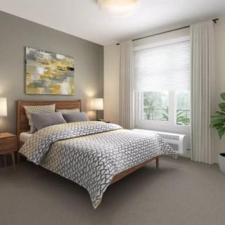 A modern bedroom with stylish decor and a large window.
