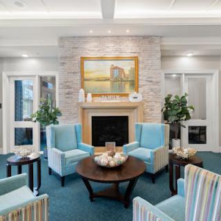 A modern living room with a fireplace and comfortable seating.