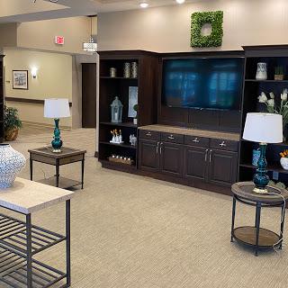 A welcoming lobby area featuring modern furniture and decorative elements.
