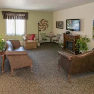 A cozy living room with comfortable seating and stylish decorations.