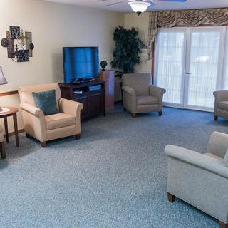 A cozy living room with comfortable seating and a television.