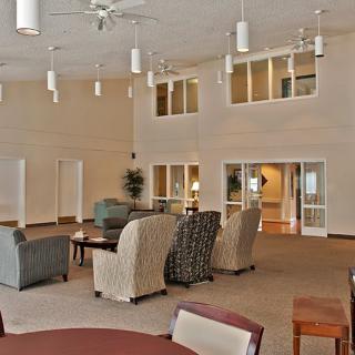 A spacious and modern lounge area featuring comfortable seating arrangements.