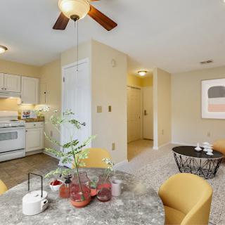 A bright and inviting open-concept kitchen and dining area, featuring modern furnishings and stylish decor.