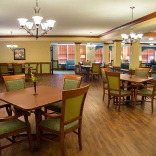 A well-designed dining area with spacious seating arrangements and a warm ambiance.