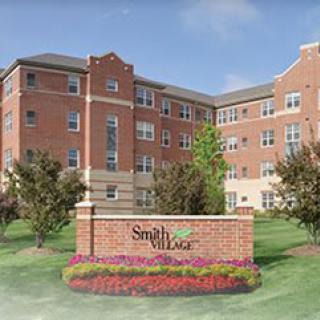 A multi-story residential building with a sign reading 'Sandy Hill'.