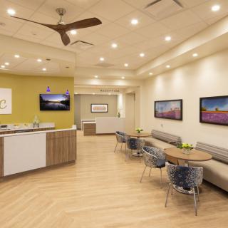 A modern office reception area with comfortable seating and stylish decor.