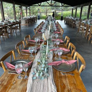 A beautifully arranged outdoor dining setup, perfect for a special event amidst nature.