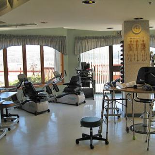 A serene spa interior featuring massage chairs and a calm ambiance.