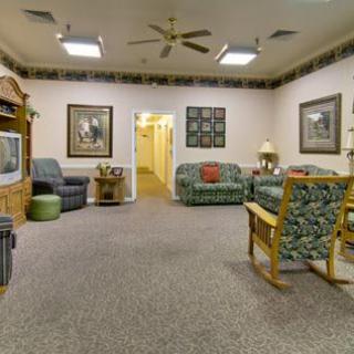 A cozy living room with comfortable seating and a television.