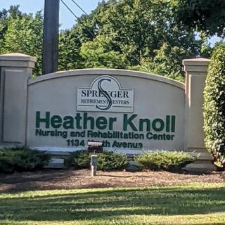 Entrance sign for Heather Knoll Nursing and Rehabilitation Center.