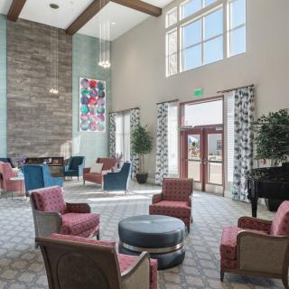 A spacious and modern lobby with comfortable seating and large windows.