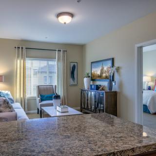 A modern and cozy living room with natural light and stylish decor.