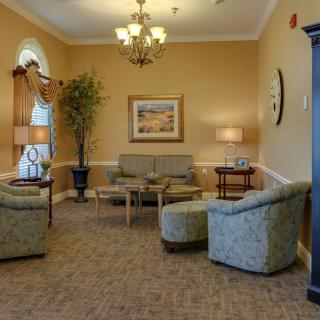 A cozy living room with comfortable seating and elegant decor.